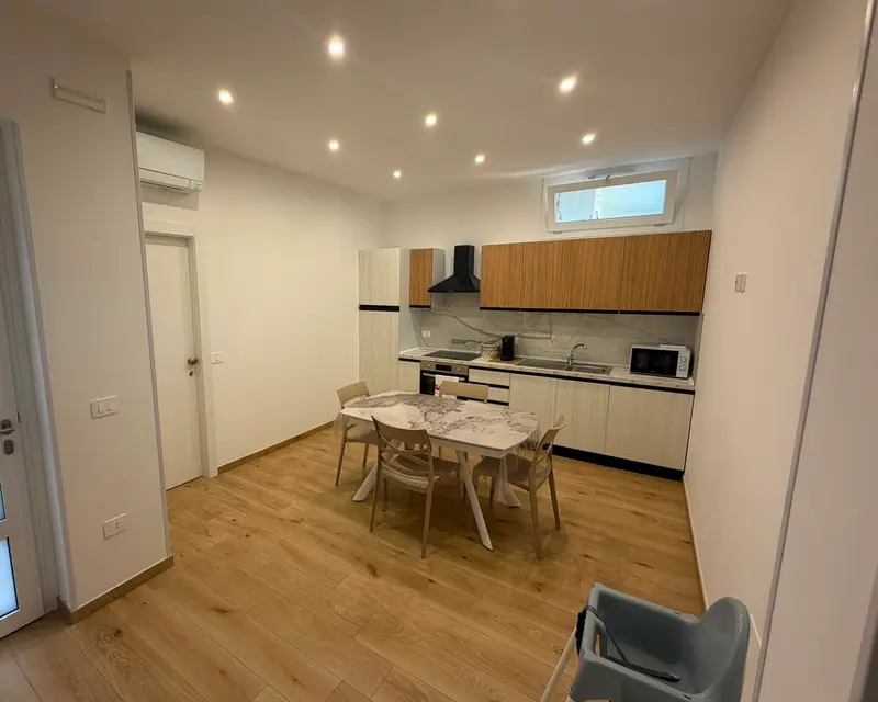 The shared kitchen with a dining table for six